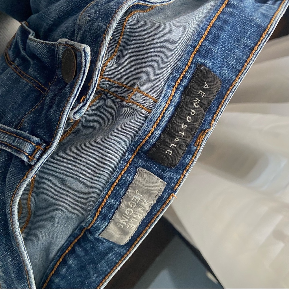 Tattered low rise skinny jeans